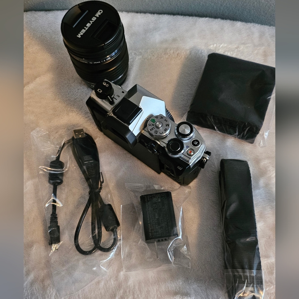 OM SYSTEM OM-5 Silver and Black Digital Camera and 12-45mm pro lens